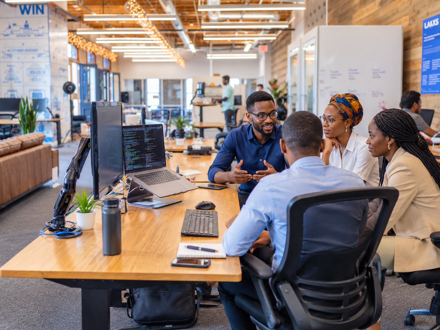 African professionals working together at a desk in a modern office